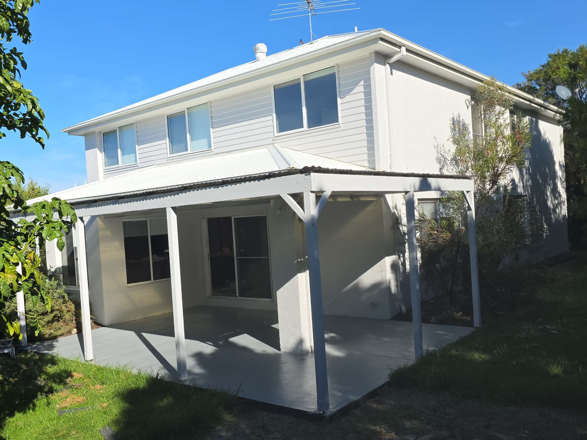 Fresh exterior repaint of a modern two-storey family home in Torquay