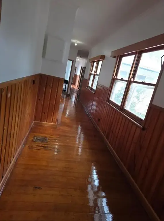 Newtown hallway with freshly stained timber floor, wainscoting and window frames