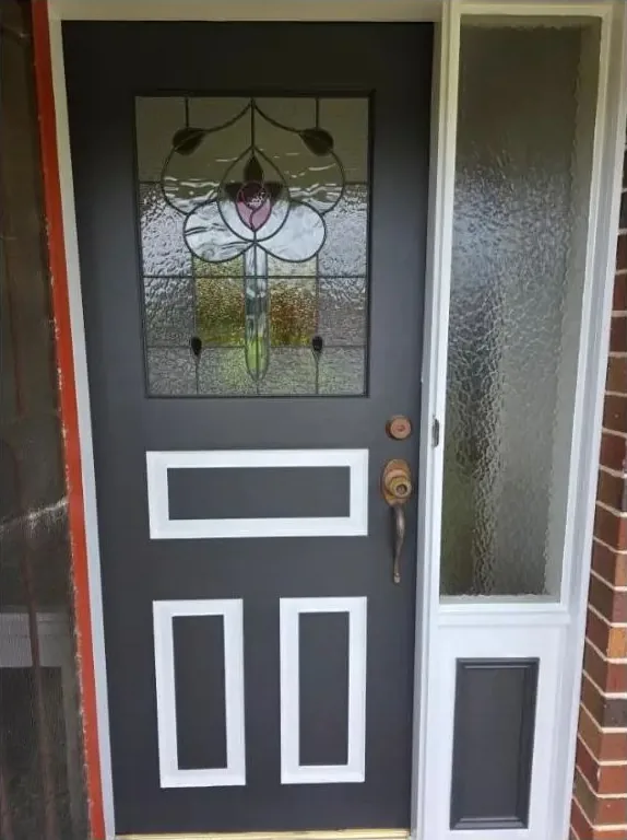 Painted charcoal leadlight front door and sidelight in Newtown with white trim and brass hardware