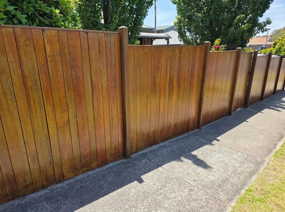 Restored and re-stained timber fence on a Highton property